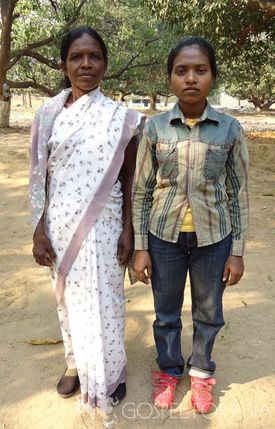 Sana stands beside her daughter, Amrita, after being healed of a disease that kept her bedridden.
