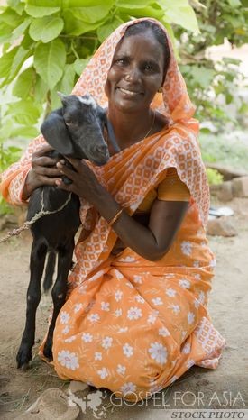 Woman with goat - Gospel for Asia - KP Yohannan