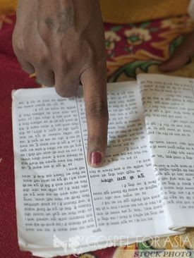 woman reading literature - Gospel for Asia - KP Yohannan
