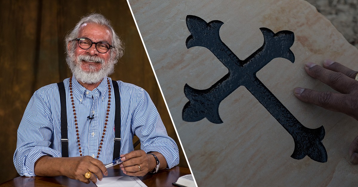 K.P. Yohannan and St. Thomas cross carved in stone. 