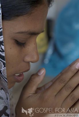 woman praying and fasting - Gospel for Asia - KP Yohannan