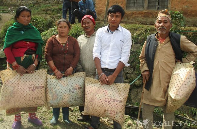 Bidur and a few other brothers and sisters receive winter blankets.