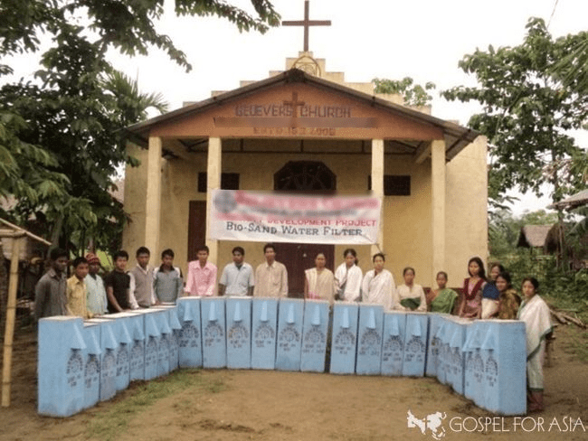 These men and women received new BioSand water filters at the distribution conducted by Pastor Dayala. These water filters will turn their stagnant, foul-smelling pond water into a healthy, clean glass of water. 