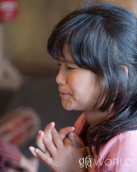 Woman praying just like the sisters of compassion.