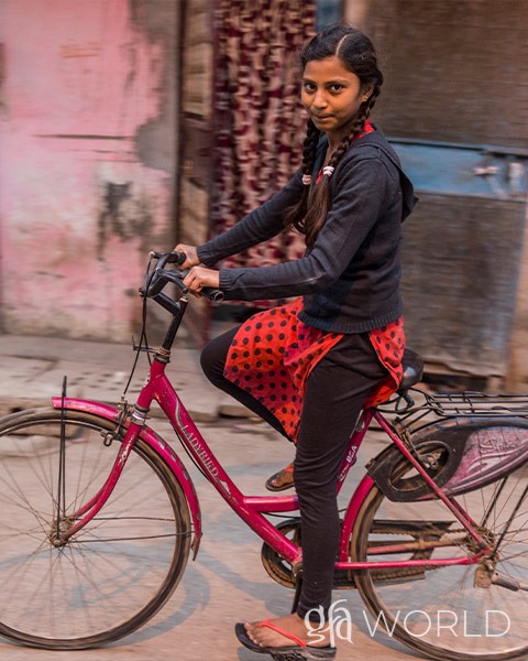 Girl received a bicycle from a gift distribution.