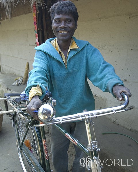 Man happy to have a bicycle he received through GFA World.